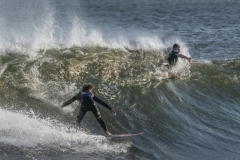 Surfers-2-one-in-wave